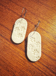 Cream - paw print dangles