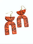 Orange tiger print arches