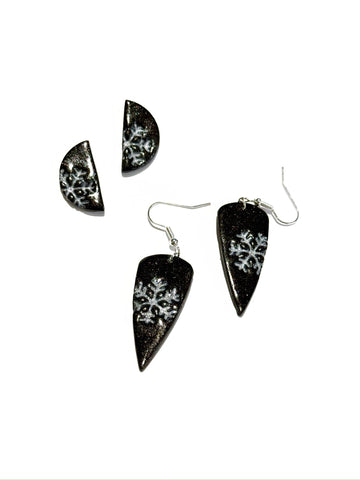 Silver snowflakes on black